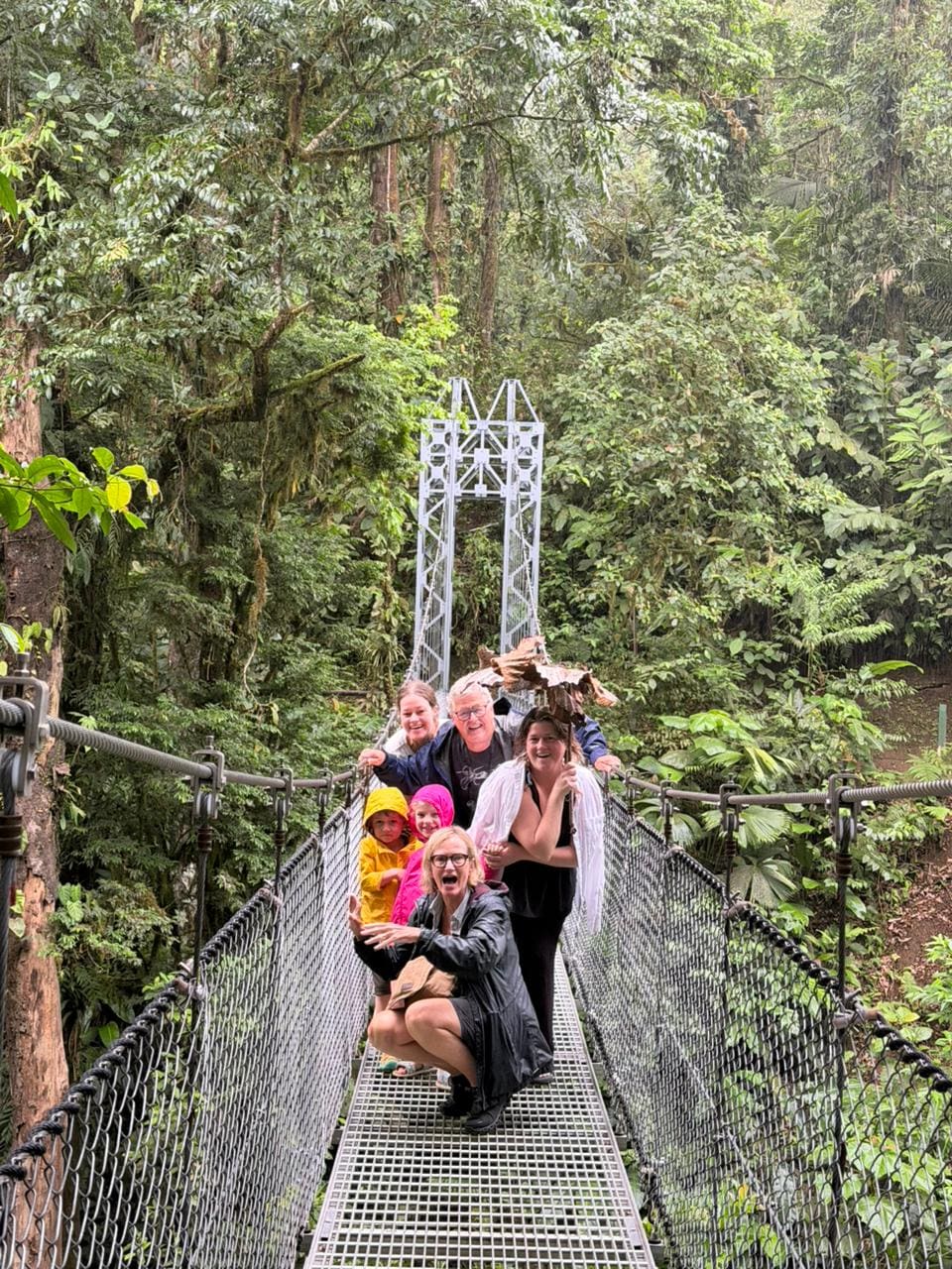 Group photo on a Mistico Park suspension bridge, La Fortuna