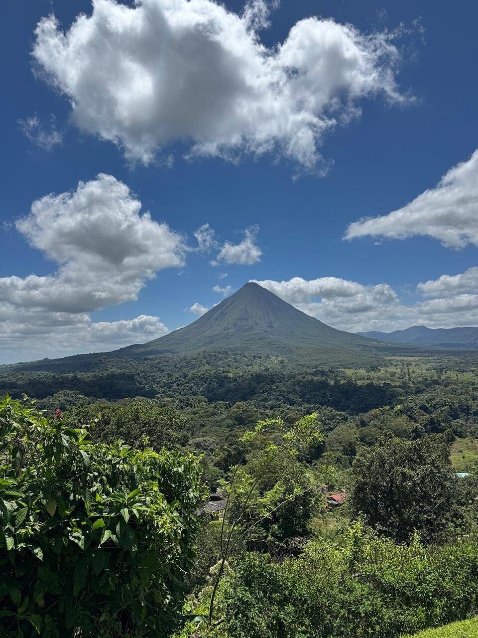 Mistico Park visitors with Arenal Volcano in the background