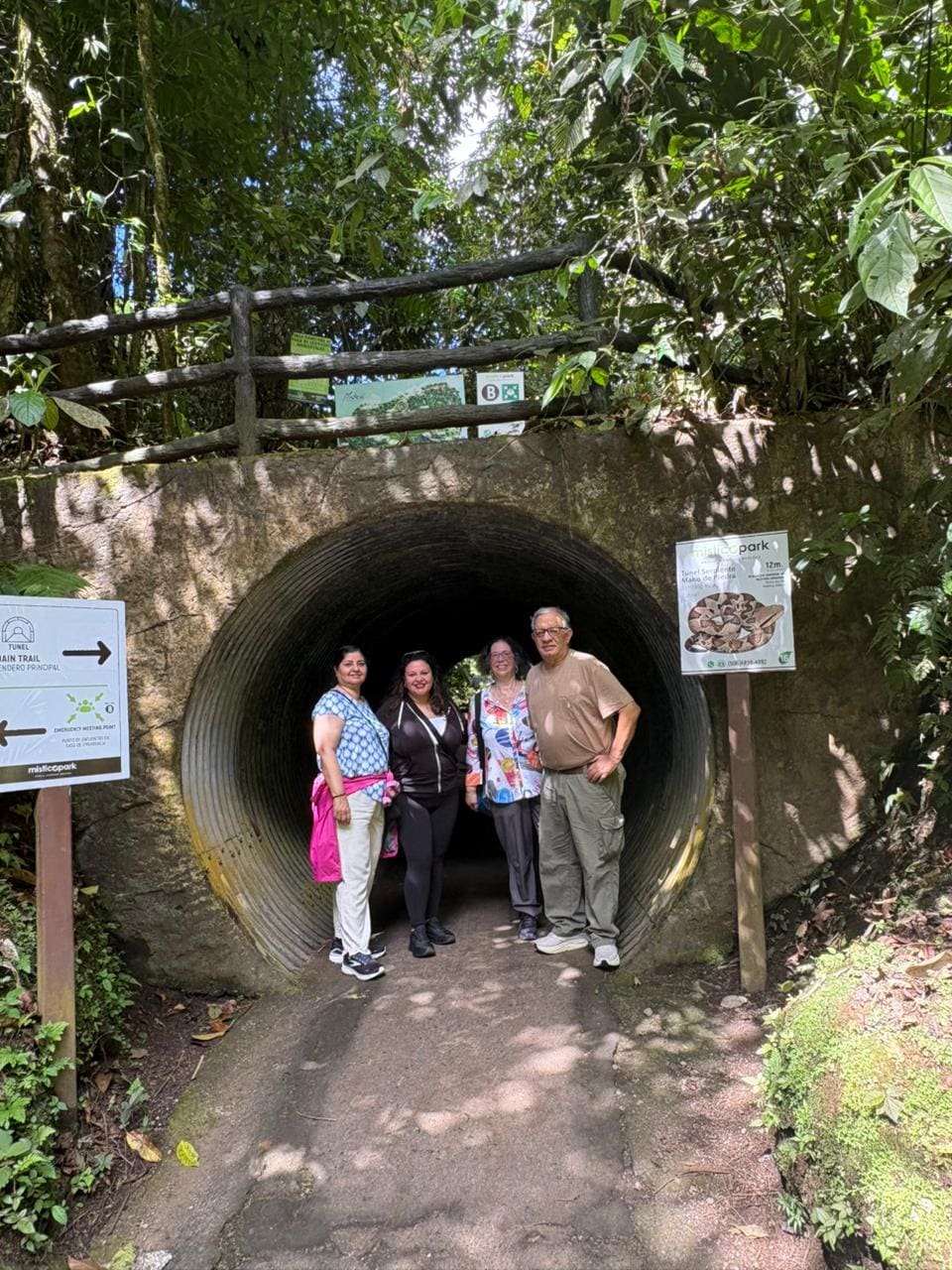 Guests walking through the snake tunnel at Mistico Park, La Fortuna