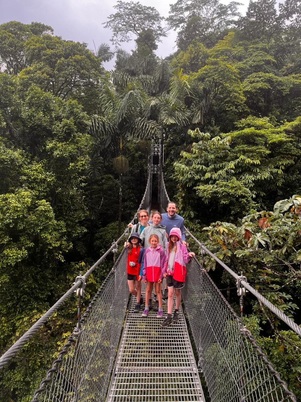 Group walking the Mistico hanging bridges trail in Arenal