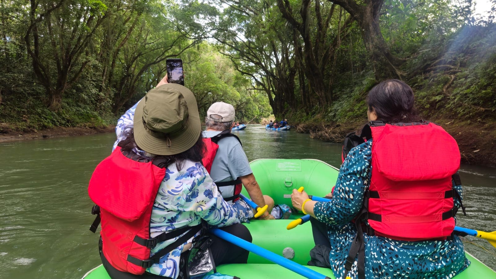 Group on a raft spotting wildlife on the Peñas Blancas safari